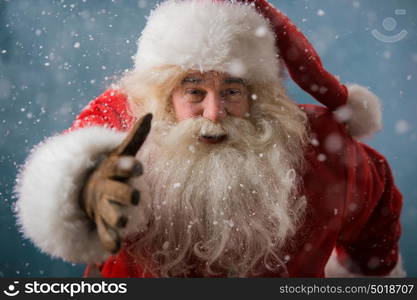 Santa Claus running outdoors at North Pole. Trying to be in time working on delivery gifts to children