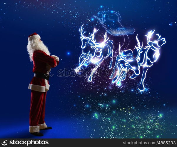 Santa Claus. Santa Claus and christmas deers in sled