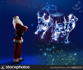 Santa Claus. Santa Claus and christmas deers in sled