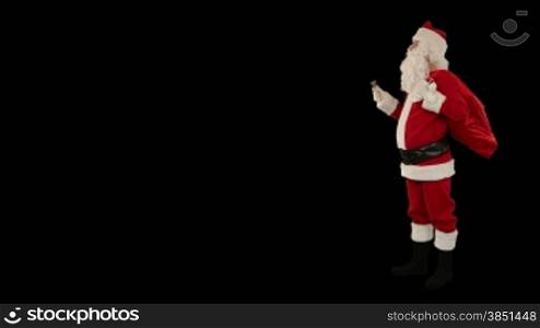 Santa Claus shaking a bell with space for text, against black