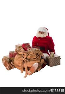 Santa Claus sitting with his big bag full of gifts and toys Full-Length Portrait
