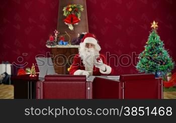 Santa Claus talking in a Christmas Room, time-lapse
