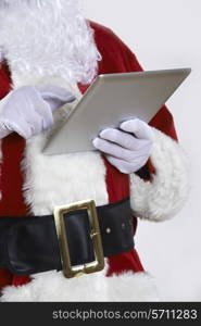 Santa Claus Using Digital Tablet On White Background