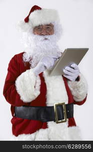 Santa Claus Using Digital Tablet On White Background