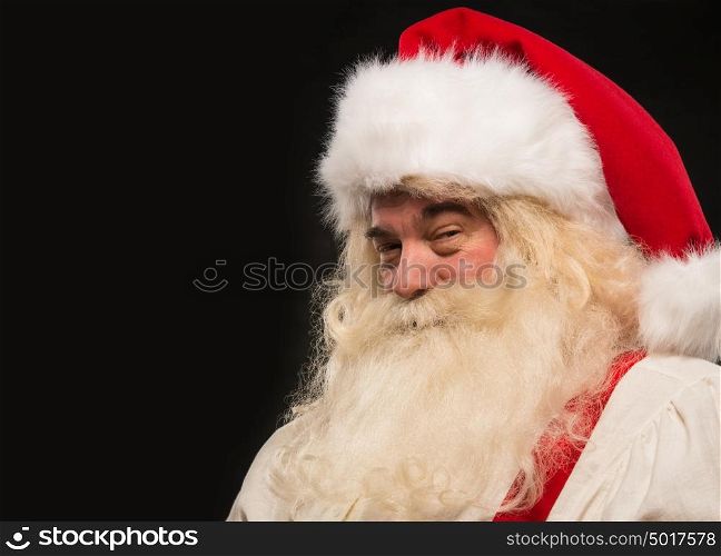 Santa Claus vintage style portrait smiling against dark black background