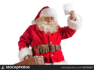 Santa Claus with old leather suitcase isolated on white background. Travel concept or postal delivery service.