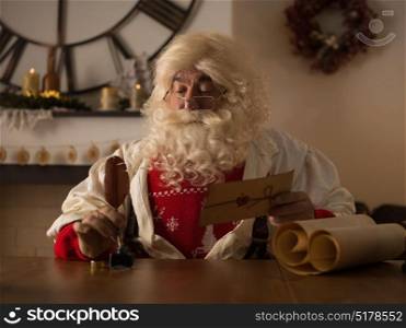 Santa Claus Working at Home. Reading and Writing letters for Children