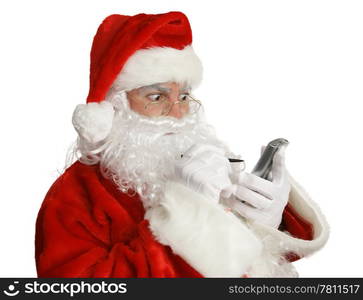 Santa Clause checking his naughty list on his pda. Isolated.