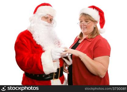 Santa Clause giving his wife a beautiful diamond ring for Christmas. Isolated on white.