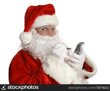 "Santa Clause smiling as he checks his "nice" list on his pda."