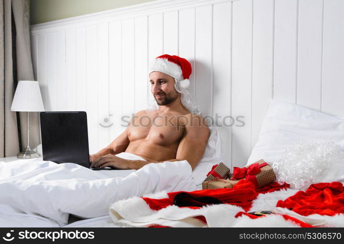 Santa getting ready for Christmas. Santa Claus in hotel room without costume shopping for Christmas or New Year