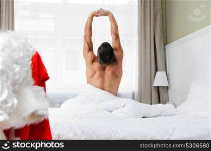 Santa getting ready for Christmas. Santa Claus in hotel room without costume getting ready for Christmas or New Year