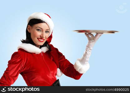 Santa girl. Excited Santa Girl presenting your product, lots of copy-space