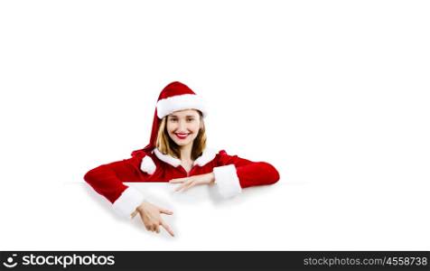 Santa girl. Girl in Santa costume with white blank banner. Place for text