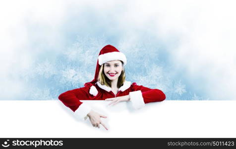 Santa girl. Girl in Santa costume with white blank banner. Place for text