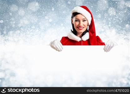 santa girl with a blank banner. Portrait of a santa girl with a blank banner