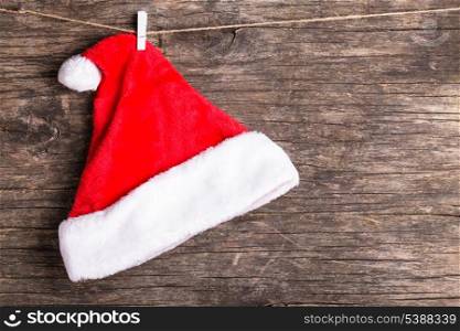 Santa hat attached to the rope with clothespin