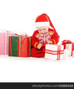 santa helper baby with christmas gifts over white