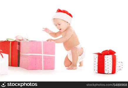 santa helper baby with christmas gifts over white