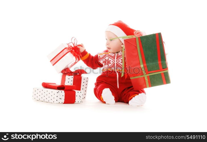 santa helper baby with christmas gifts over white