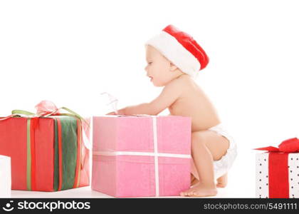 santa helper baby with christmas gifts over white