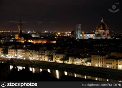 Santa Maria di Fiore Cathedral, Florence, Italy and the Arno river at night