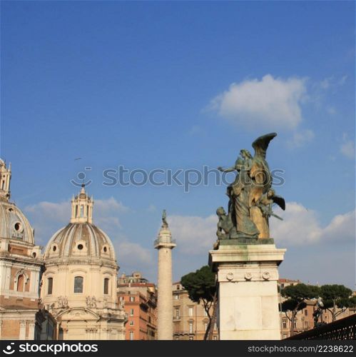 Santa Maria di Loreto church and statue in front of National Monument of Victor Emmanuel II, Rome, Italy .. Santa Maria di Loreto church and statue in front of National Monument of Victor Emmanuel II, Rome, Italy