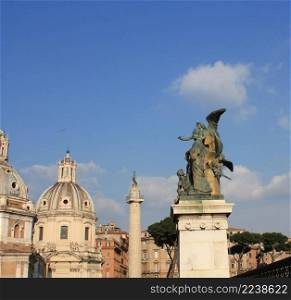 Santa Maria di Loreto church and statue in front of National Monument of Victor Emmanuel II, Rome, Italy .. Santa Maria di Loreto church and statue in front of National Monument of Victor Emmanuel II, Rome, Italy