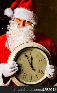 Santa with clock. Santa Claus holding clock with countdown to Christmas or New Year