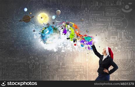 Santa woman having mobile dialogue. Pretty businesswoman wearing Christmas hat screaming in mobile phone. Elements of this image are furnished by NASA