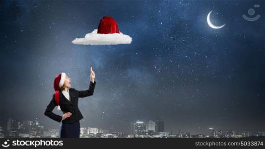 Santa woman. Santa woman pointing up on red bag with finger