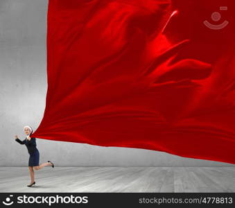 Santa woman with red banner. Young Santa businesswoman pulling red clothing banner