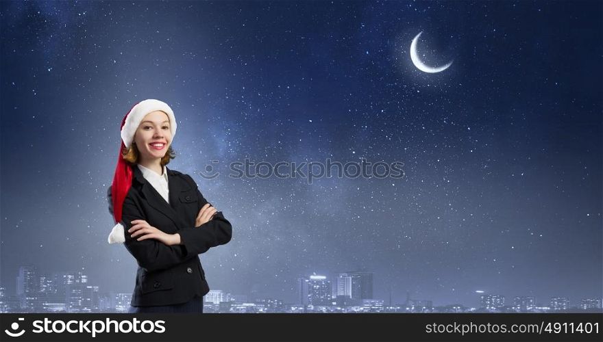 Santa woman. Woman in suit and Santa hat with arms crossed on chest