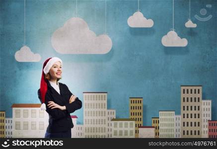 Santa woman. Woman in suit and Santa hat with arms crossed on chest