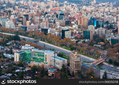 Santiago, Metropolitan Region, Chile - Panoramic view of Providencia district with Mapocho River and the snowed Andes mountain range in the back.