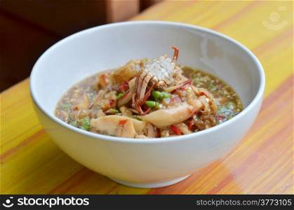 santol salad with steamed crab in white bowl