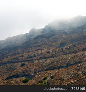 santorini europe greece and dry bush rock alone in the sky