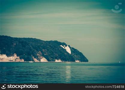 Sassnitz. The famous chalk cliffs shoreline of Jasmund National Park ruegen island germany, view from yacht boat. Chalk cliff rocks of Rugen isle at Sassnitz Germany