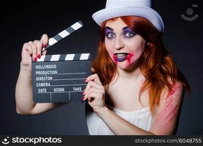 Satan halloween concept with movie clapper board