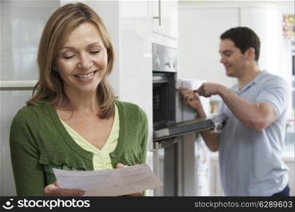 Satisfied Female Customer With Oven Repair Bill