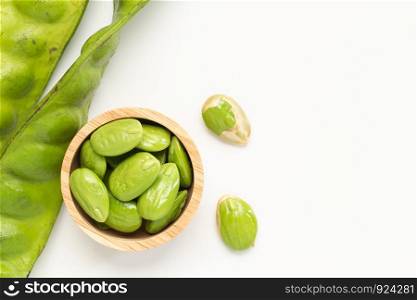 Sato seeds, Bitter bean in the Wooden bowl isolated on white background, Thai vegetable food