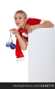 Saucy Miss Santa with baubles and a board left blank for your message