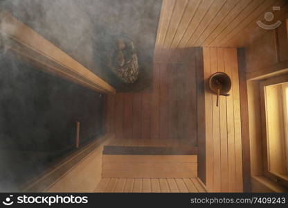 sauna, wooden interior baths, wooden benches and loungers accessories for sauna, spa complex in the hotel