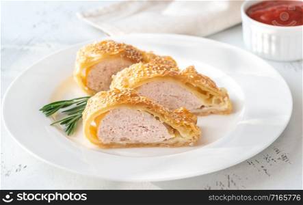 Sausage rolls with tomato sauce and fresh rosemary