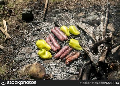 Sausages and peppers on grill