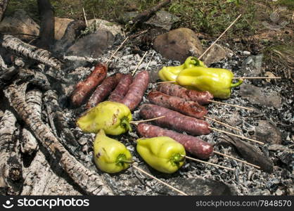 Sausages and peppers on grill