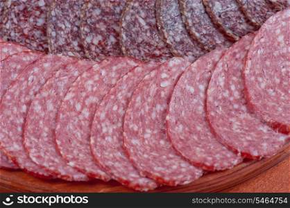 Sausages background with many sliced