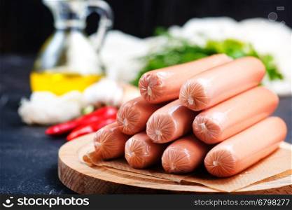 sausages on board and on a table