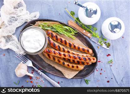 sausages on plate and on a table