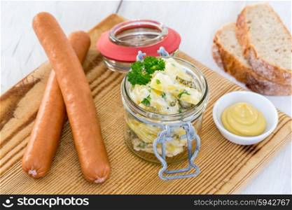 Sausages with mustard and potato salad. Sausages with mustard and potato salad.
